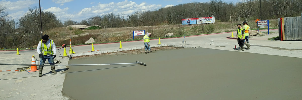 smoothing out freshly poured concrete